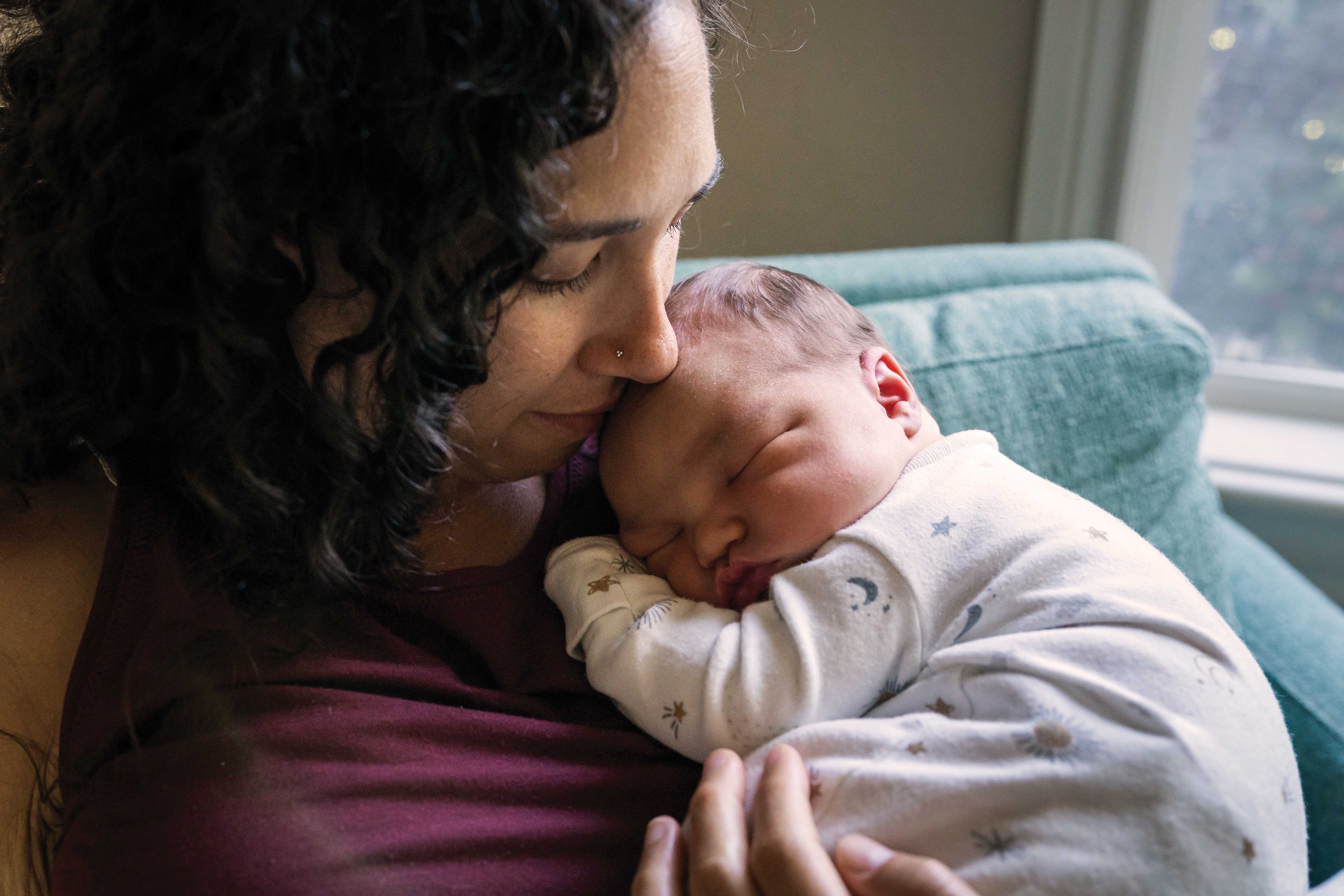 Mother holding newborn baby